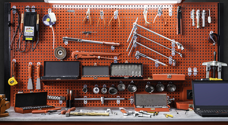 DIY tools hanging on a wall in a dream garage